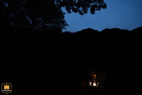 Bathed in early morning light, the bride sits quietly in the Shanxi hotel courtyard, applying her makeup and savoring a peaceful start to her wedding day.